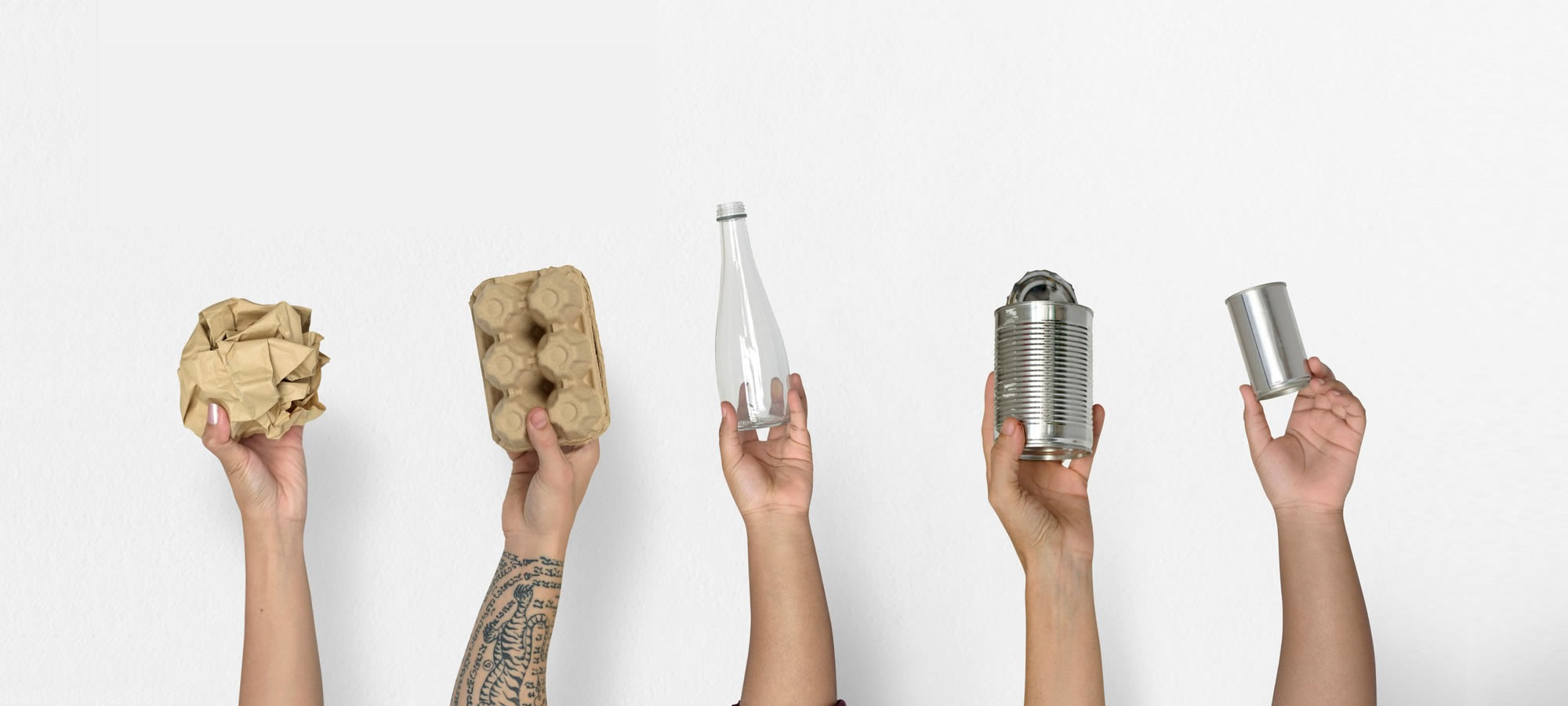 hands holding waste for recycling